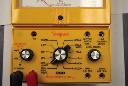 Switches and terminals on an analog multimeter.