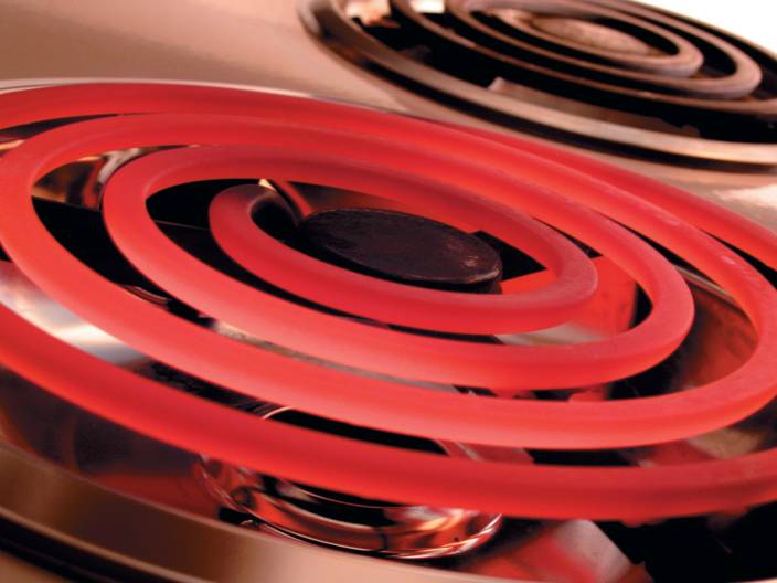 High current causes a stove heating element burner to glow red.